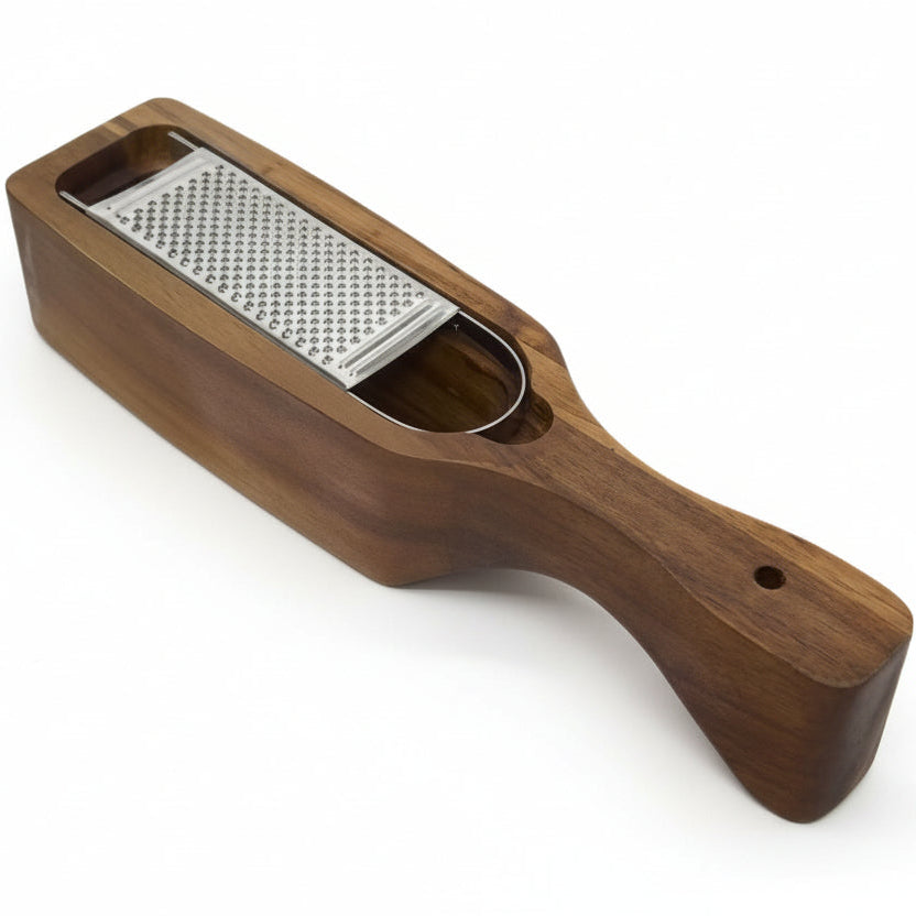 A wooden hand grater with a silver metal grating surface and a contoured handle, shown on a plain white background.